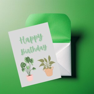 Cartão de feliz aniversário com plantas em vasos