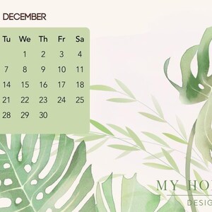 May include: A December calendar page featuring a light green rectangular grid with black text for dates and days of the week. The background displays watercolor illustrations of large green monstera leaves and slender foliage with the text MY HOMING DESIGN.