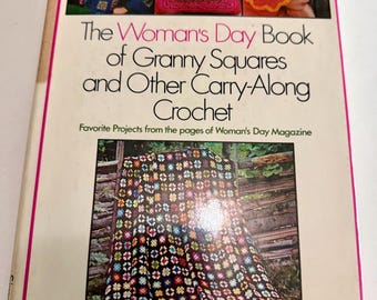 May include: The Woman's Day Book of Granny Squares and Other Carry-Along Crochet, a softcover book featuring a white cover with a large black text title and colorful photographs of crocheted items including a blanket, a sweater, and a hat.