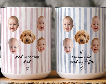 May include: Two ceramic mugs with black handles and rims. The left mug has pink stripes, four baby faces, one dog face, and the text good morning dad. The right mug has blue stripes, four baby faces, one dog face, and 5 reasons for needing coffee.