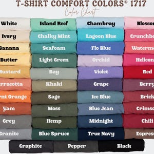 May include: A color chart displaying a variety of T-shirt colors. The chart includes shades like white, ivory, banana, and mustard, as well as greens, blues, purples, reds, and browns. The text "T-SHIRT COMFORT COLORS&reg; 1717" is at the top.