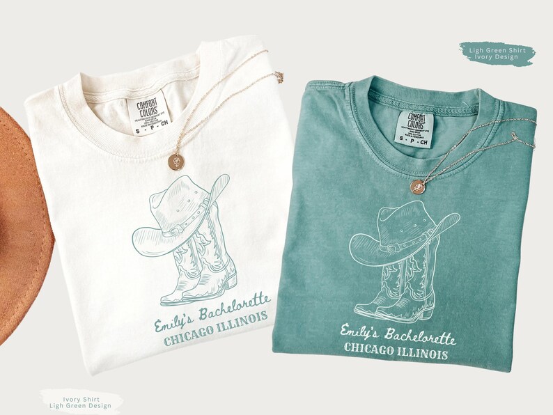 May include: Two t-shirts, one ivory and one light green, each with a cowboy hat and boot design. The text "Emily's Bachelorette CHICAGO ILLINOIS" is printed below the graphic. Each shirt has a gold necklace.