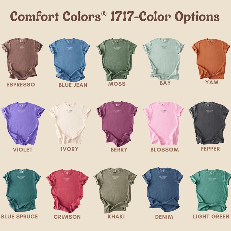 May include: A display of Comfort Colors t-shirts in various colors, including Espresso, Blue Jean, Moss, Bay, Yam, Violet, Ivory, Berry, Blossom, Pepper, Blue Spruce, Crimson, Khaki, Denim, and Light Green. The text "Comfort Colors 1717-Color Options" is at the top.
