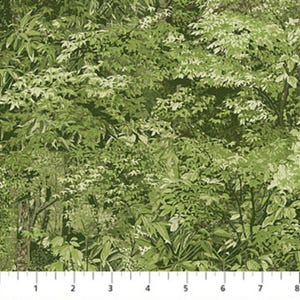 May include: Fabric with a lush green forest design. The pattern features a dense arrangement of leaves in various shades of green and white, creating a natural, textured appearance. The design includes a ruler at the bottom, with markings in inches.