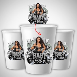 May include: White paper cups with a graphic design featuring a woman in a black outfit, surrounded by diamonds, money, and disco balls. The text "BABY Bitch" is displayed below the woman.