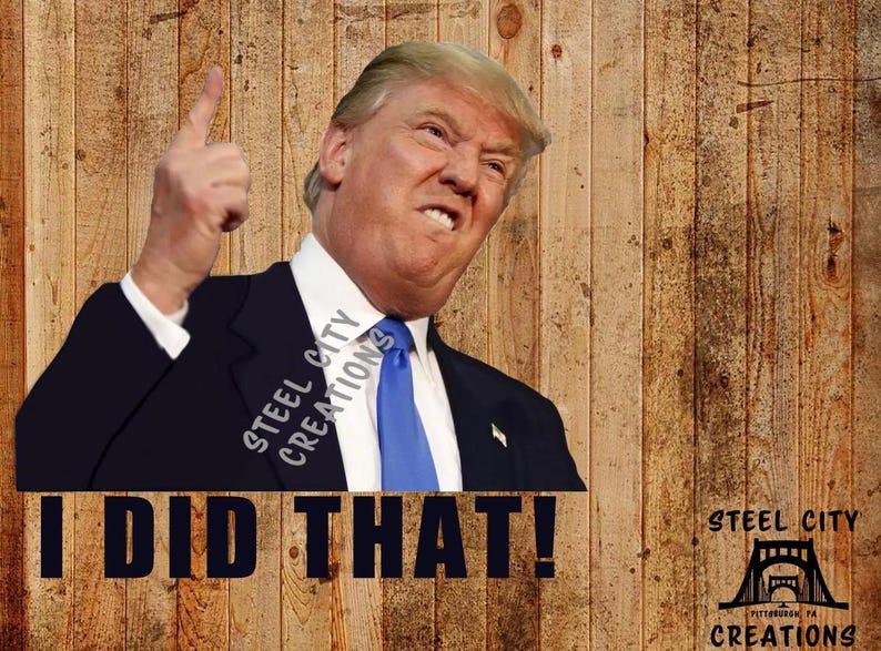 May include: A man in a dark suit and blue tie points his finger upwards and says "I DID THAT!" with a serious expression. The background is a wood grain pattern. The text "STEEL CITY CREATIONS" is visible in the image.