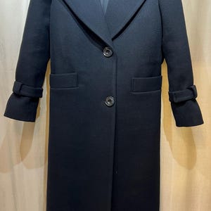 Elegant long wool coat, 100% premium wool, timeless design with belt or button closure—perfect for effortless style in any season