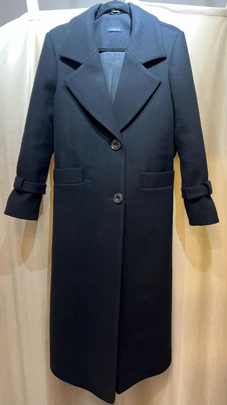 Elegant long wool coat, 100% premium wool, timeless design with belt or button closure—perfect for effortless style in any season