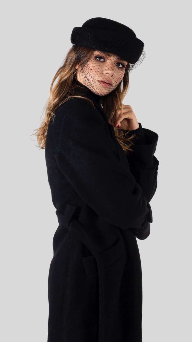 Elegant long wool coat, 100% premium wool, timeless design with belt or button closure—perfect for effortless style in any season