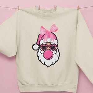Coquette Bow Santa Claus Christmas Sweatshirt, Holiday Santa Sweatshirt, Christmas Bow Sweater, Festive Holiday Jumper, Cute Santa Claus