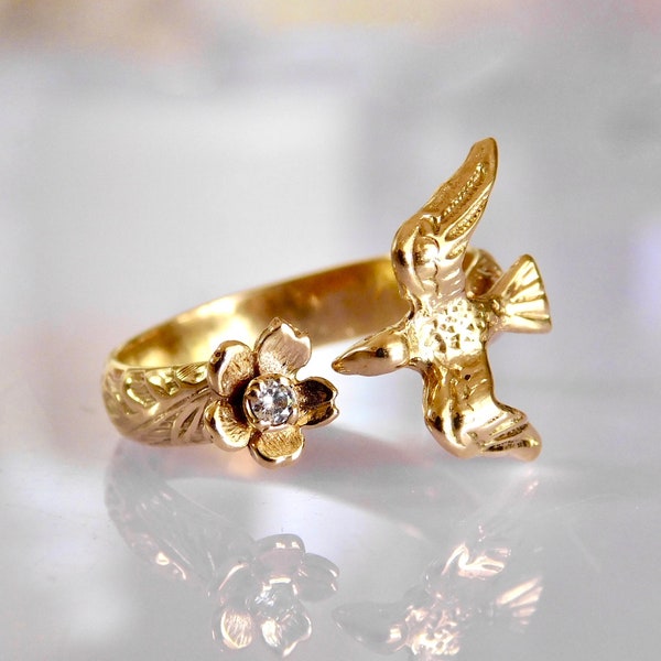 Bird kissing a flower diamond ring in solid gold