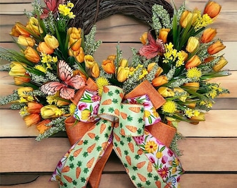 May include: A spring-themed wreath with orange and yellow tulips, green leaves, and a bow with a carrot pattern. The wreath is made of twigs and is decorated with butterflies.