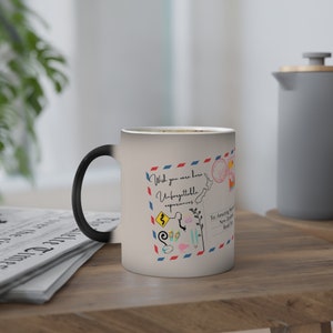 Kiwi Magic Farbwechsel-Tasse mit Postkarte und Symbolen von Neuseeland