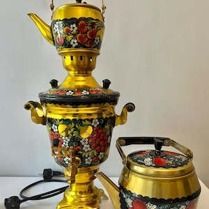 May include: A set of three ceramic mugs with a speckled, matte finish. The mugs are in shades of cream, light gray, and dark gray. Each mug has a simple, minimalist design, perfect for coffee or tea.