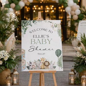 Safari baby shower welcome sign featuring cute jungle animals, soft greenery accents, and elegant typography, printed on premium white foam board. Personalized with name, event title, and date, this custom welcome board is perfect for safari-themed baby showers, venue entrances, gift tables, and photo areas. Stylish jungle baby shower décor designed to create a warm first impression and lasting keepsake