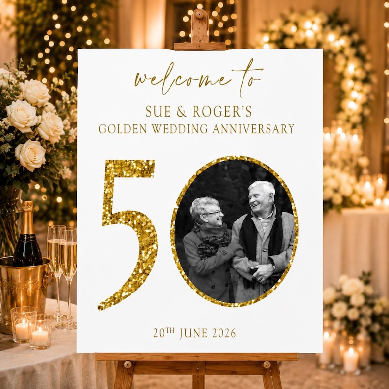 May include: A white sign on a wooden easel with gold text that reads "welcome to Sue & Roger's Golden Wedding Anniversary." A gold glitter "50" is next to a black and white photo of a couple. The date "20th June 2026" is at the bottom.