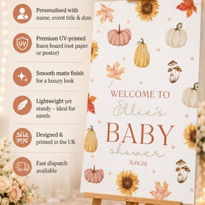 May include: A baby shower sign on a wooden easel. The sign features watercolor illustrations of pumpkins, sunflowers, and leaves. Text on the sign reads "Welcome to Ellie's BABY shower 31.01.26". The sign is designed and printed in the UK.