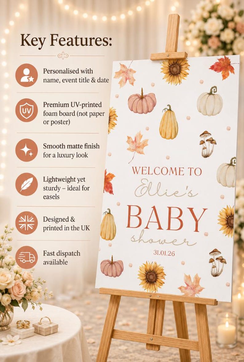 May include: A baby shower sign on a wooden easel. The sign features watercolor illustrations of pumpkins, sunflowers, and leaves. Text on the sign reads "Welcome to Ellie's BABY shower 31.01.26". The sign is designed and printed in the UK.