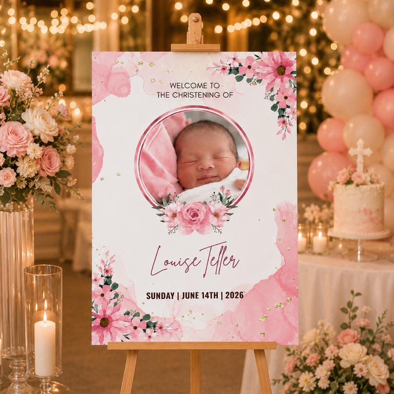 May include: A pink and gold christening welcome sign on an easel. The sign displays a baby's photo in a floral frame, the name "Louise Teller", and the date "Sunday | June 14th | 2026".