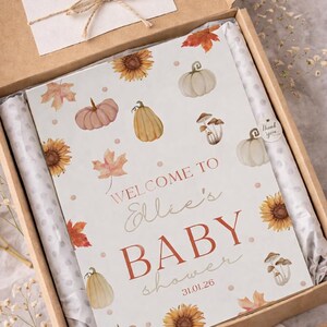 May include: A4 size baby shower sign in a cardboard box. The sign features watercolor illustrations of pumpkins, sunflowers, and leaves. Text reads "WELCOME TO Ellie's BABY shower 31.01.26". Includes a "Thank you" card.