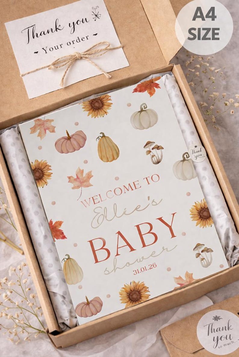 May include: A4 size baby shower sign in a cardboard box. The sign features watercolor illustrations of pumpkins, sunflowers, and leaves. Text reads "WELCOME TO Ellie's BABY shower 31.01.26". Includes a "Thank you" card.
