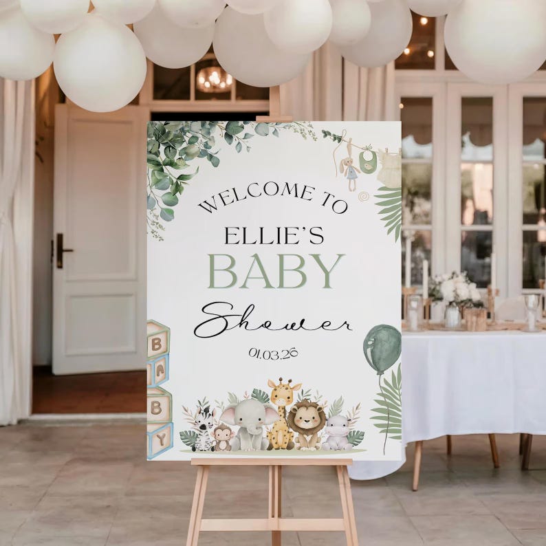 Pu&ograve; includere: Un cartello di benvenuto per un baby shower su un cavalletto. Il cartello recita "Benvenuti al Baby Shower di Ellie" con una data. Il design include fogliame verde, un palloncino e animali dei cartoni animati. Palloncini bianchi sono appesi al soffitto.