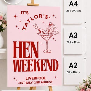 May include: Pink foam board sign for a hen weekend. The sign features the text "IT'S TAYLOR'S, HEN WEEKEND, LIVERPOOL 31ST JULY- 2ND AUGUST" in red. Available sizes are A4 (21 x 29.7 cm), A3 (29.7 x 42 cm), and A2 (60 x 40 cm).