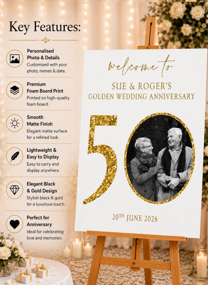 May include: A white sign on a wooden easel, celebrating a golden wedding anniversary. The sign reads "Welcome to Sue & Roger's Golden Wedding Anniversary" with a photo of the couple and the number "50" in gold glitter. The date "20th June 2026" is also displayed.