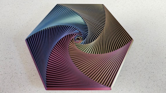 A 3D-printed fractal hexagon that telescopes and folds into satisfying nested shapes — like a fidget toy designed by a mathematician.
