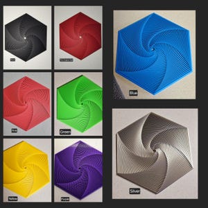 May include: A set of 10 hexagonal coasters in various colors, including black, red, green, yellow, purple, blue, and silver. Each coaster features a swirling, geometric design.