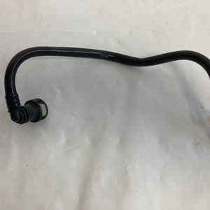 May include: Black fuel line with a white connector on one end and a black connector on the other end.