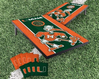 Miami Hurricanes Cornhole Boards 2x3 (Officially Licensed) Carry Case, Board Covers, & Score Tower Add-Ons