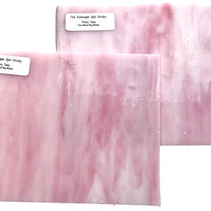 May include: Two pieces of pink bubblegum opal streaky glass, Tiffany style, from Mixed Dog Mosaic.