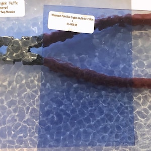 May include: Pale blue English Muffle glass sheet, 8x12 inches, transparent, with a textured surface. Wissmach Pale Blue English Muffle 8x12 Glas $ 02-4909-08