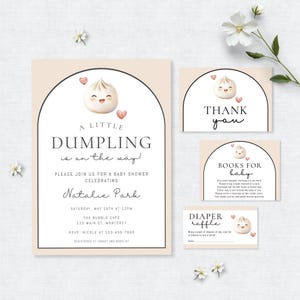 May include: A baby shower invitation with a pink and white dumpling illustration. The invitation says "A Little Dumpling is on the way!" and includes the name Natalie Park, the date and time of the shower, and the location. There are also thank you cards, a diaper raffle card, and a "Books for Baby" card.