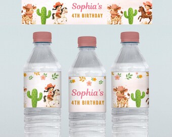 May include: Clear plastic water bottles with pink caps and labels featuring a cowgirl theme. The labels include illustrations of a cow, cactus, and a cowgirl on a horse, with the text "Sophia's 4th Birthday".