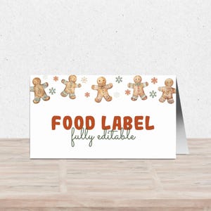 May include: White printable food label with a gingerbread man theme. The label has a brown border and the text "FOOD LABEL fully editable" in brown and green.