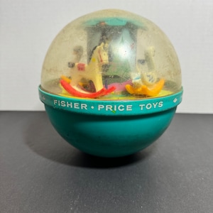 Fisher Price Roly Poly Chime Carousel Toy