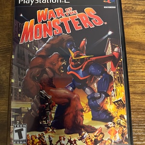 May include: A PlayStation 2 video game case for War of the Monsters. The cover art features a large brown ape-like creature fighting a blue and red robot in a city setting with fire and fleeing people. The ESRB Teen rating logo is in the corner.