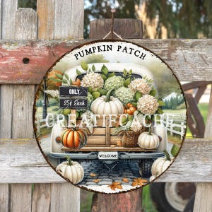 May include: Circular metal sign with a distressed finish, depicting a vintage truck laden with pumpkins and flowers. The sign displays the words "Pumpkin Patch" and "Create Cache". Additional text includes "Only 25¢ Each" and "Welcome".