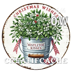 May include: A white round sign with the text "Christmas Wishes" and "Mistletoe Kisses" in red. The sign features a green and white mistletoe plant in a silver bucket with a red and white checked ribbon.