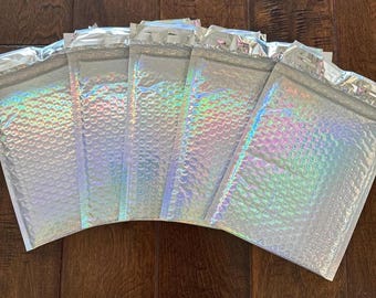 Paquete de 10 o 20 sobres de burbujas holográficos de arcoíris de 15 x 25 cm. ¡Preciosos sobres acolchados y autoadhesivos! Aprobados por USPS, UPS y FedEx.