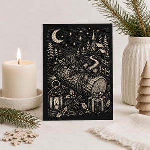 May include: A rectangular greeting card featuring a black and white woodcut-style illustration of a winter scene with a crescent moon, stars, a church, a log with a bow, a lantern, a gift box, and holly leaves against a dark background.