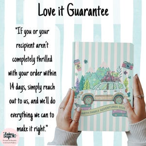 May include: A hardcover journal with a light blue and white striped cover featuring a graphic of a car with luggage on the roof, mountains, trees, and a camera. The text reads Smith Family Adventures 2026 and Love it Guarantee with return policy.