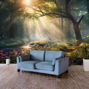 May include: A light blue two-seater sofa with dark wooden legs sits in front of a forest mural. The mural depicts a sunlit forest scene with a stream, flowers, and tall trees. A white candle and a potted plant are also visible.