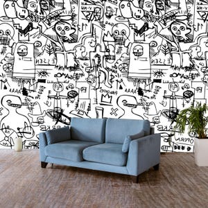 Può includere: Carta da parati con motivo astratto a doodle in bianco e nero con un divano blu davanti. La carta da parati presenta una varietà di forme e linee, tra cui cerchi, quadrati e triangoli. Il divano è un design semplice e moderno con un tessuto blu chiaro.