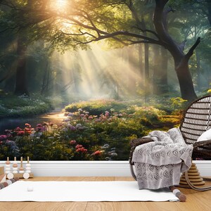 May include: A scenic forest mural with a stream, wildflowers, and sunlight streaming through the trees. A wicker chair with a gray blanket and a white rug are in the foreground. A wooden toy is on the left.