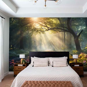 May include: A bedroom featuring a large mural of a sunlit forest scene. The mural is the focal point, with a bed, nightstands, and lamps completing the room's decor. The bed has white bedding and decorative pillows.