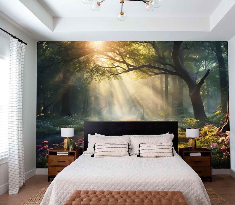 May include: A bedroom featuring a large mural of a sunlit forest scene. The mural is the focal point, with a bed, nightstands, and lamps completing the room's decor. The bed has white bedding and decorative pillows.