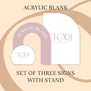May include: Set of three acrylic blank signs with a stand. The signs are shaped like an arch and a half circle. The signs are white with the text "TORI CRAFT BLANKS" printed in pink.